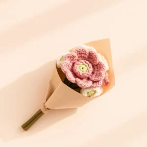 Elegant handmade crochet flower bouquet wrapped in premium kraft paper.