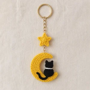 Handmade crochet moon cat keychain with yellow star and black cat
